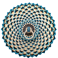 A top-down view of an elaborately woven basket in blue, black and cream